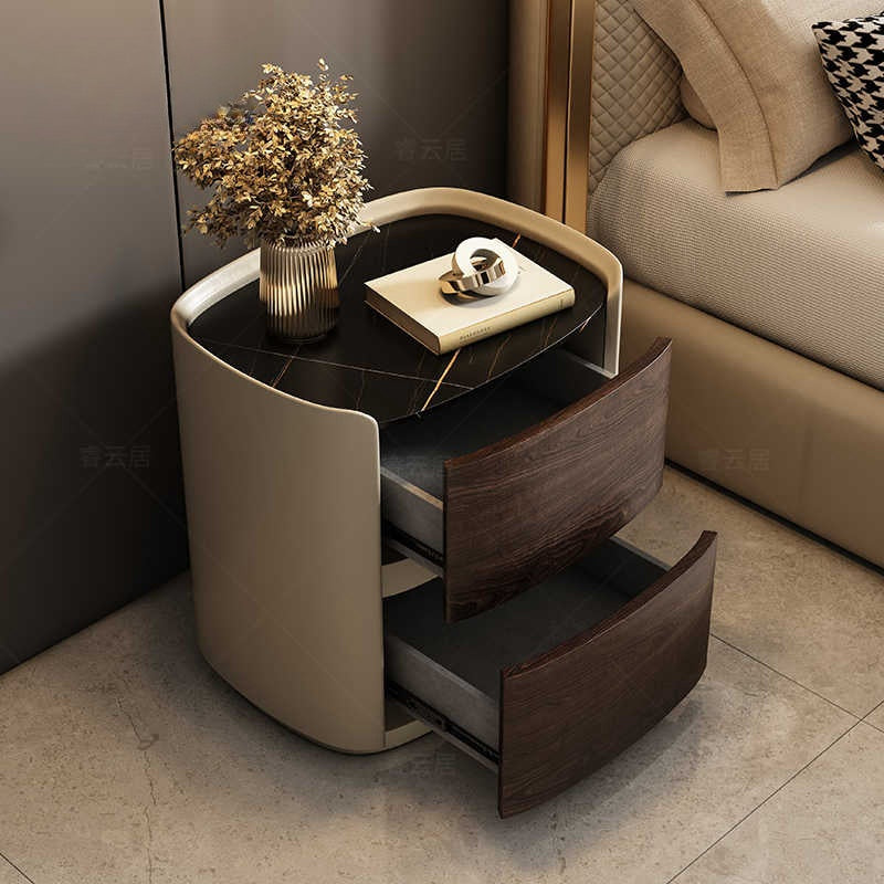 Italian minimalist high-end solid wood bedside table designer oval leather bedside cabinet Modern light luxury rock board locker
