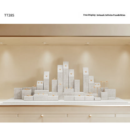White Linen Jewelry Display Set with Multi-Level Risers for Vendors