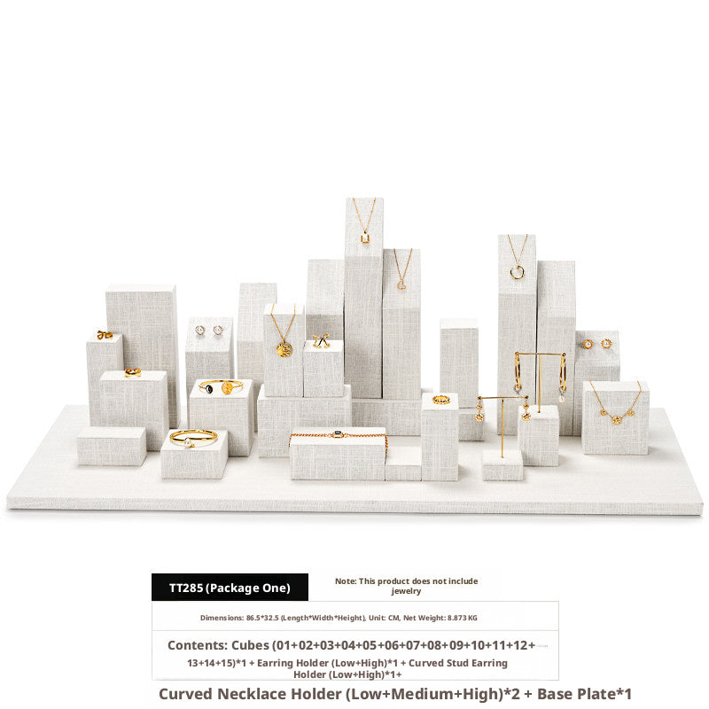 White Linen Jewelry Display Set with Multi-Level Risers for Vendors