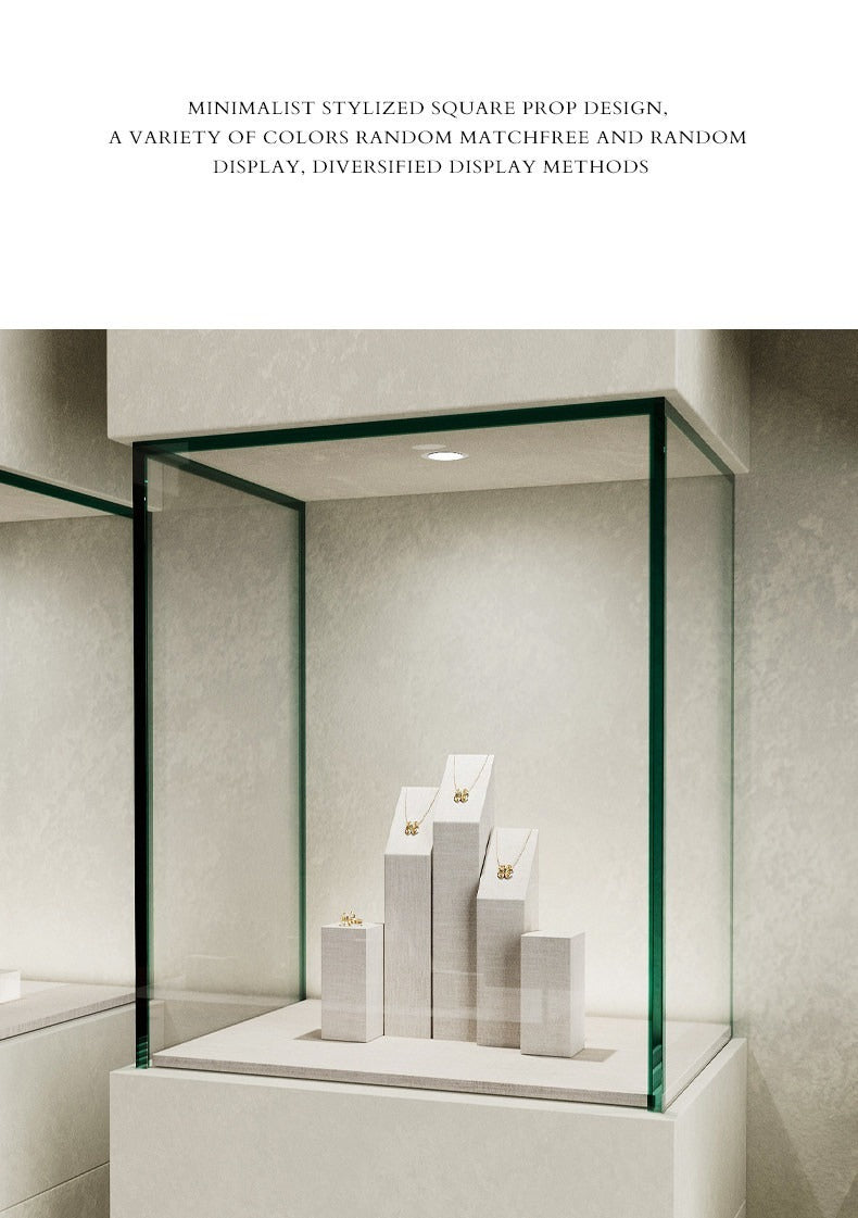 White Linen Jewelry Display Set with Multi-Level Risers for Vendors