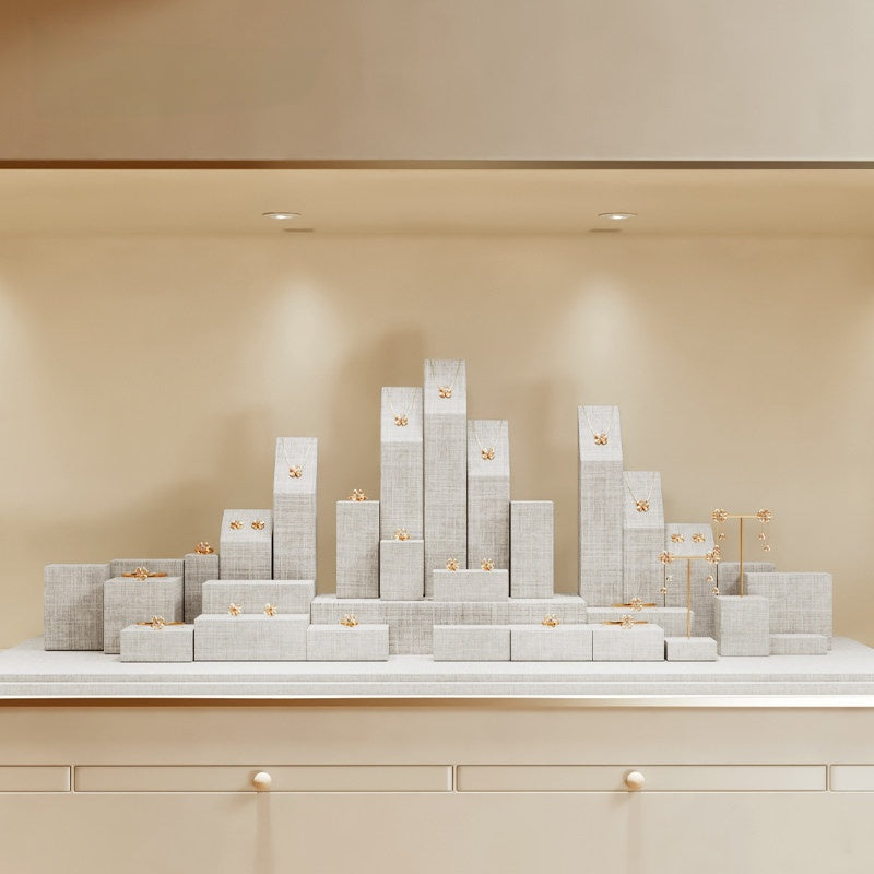 White Linen Jewelry Display Set with Multi-Level Risers for Vendors