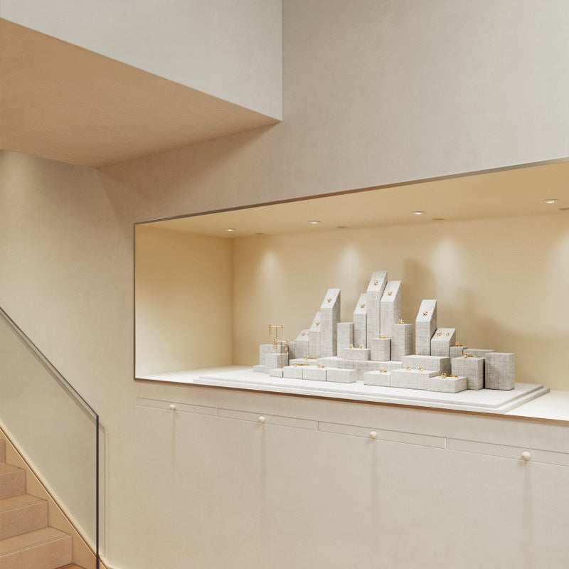 White Linen Jewelry Display Set with Multi-Level Risers for Vendors