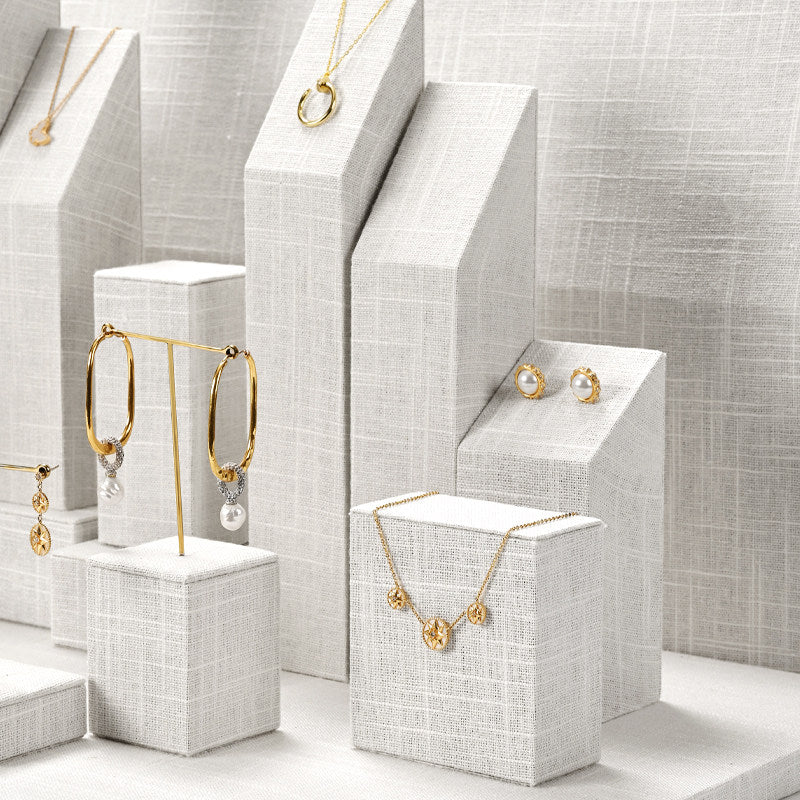 White Linen Jewelry Display Set with Multi-Level Risers for Vendors