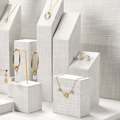 White Linen Jewelry Display Set with Multi-Level Risers for Vendors