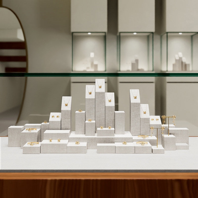 White Linen Jewelry Display Set with Multi-Level Risers for Vendors