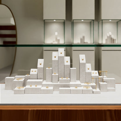 White Linen Jewelry Display Set with Multi-Level Risers for Vendors