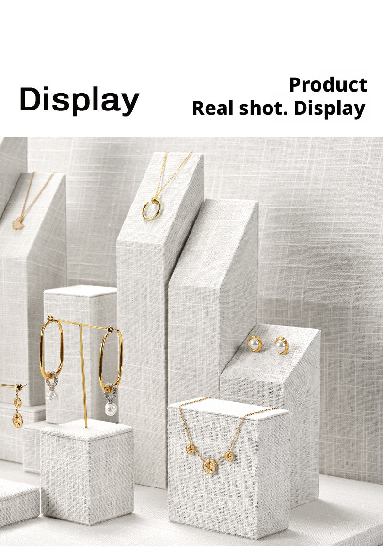 White Linen Jewelry Display Set with Multi-Level Risers for Vendors